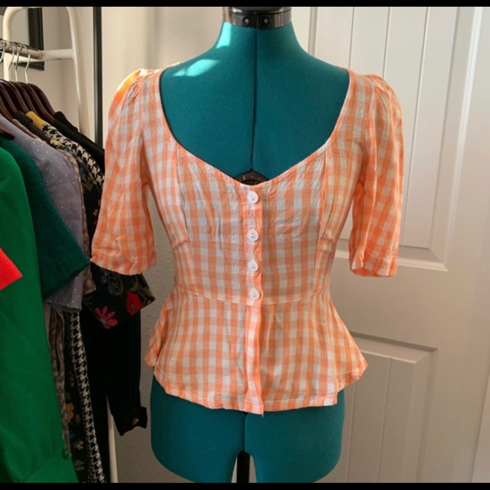 Urban Outfitters orange checkered bow blouse